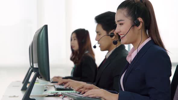 Business People Wearing Headset Working in Office