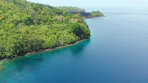 Aerial: flying over Banda Islands active volcano Gunung Api lava flows Maluku In