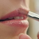 Makeup artist paints lips of a beautiful smiling girl - VideoHive Item for Sale