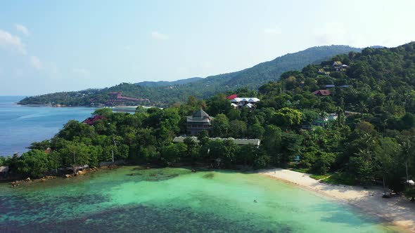 Wide aerial tourism shot of a white paradise beach and blue sea background in best quality 