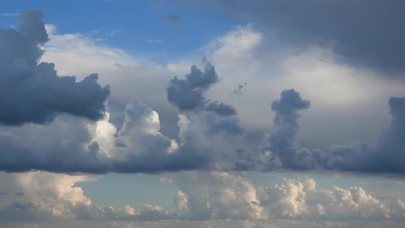 Time-lapse | puffy storm clouds dance through the blight blue sky