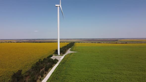 Aerial drone view of a flying over the wind turbine