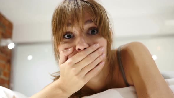 Wondering Woman Lying in Bed, Shock, Astonished