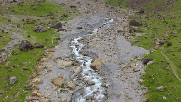 fast mountain river flowing between rocky stones. 