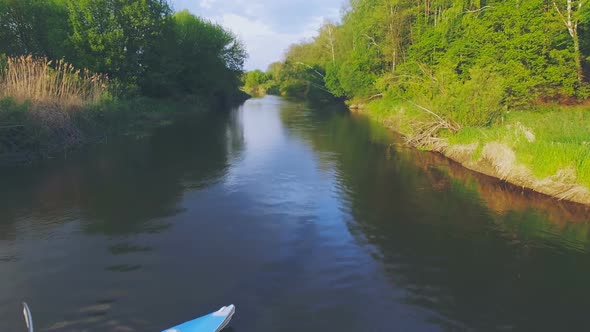 Girl in a Blue Kayak Floating