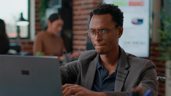 Portrait of African American Worker Sitting in Wheelchair