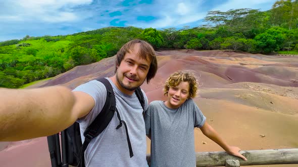 Smiling Father and Son Making Selfie on a Sunny Summer Day