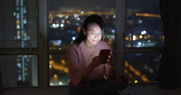 Woman use of mobile phone online