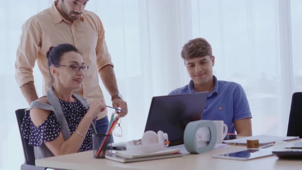 Group Meeting of Creative Business People Designer and Artist at Office Desk