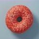 Orange Glazed Donut Rotating on Blue Top View - VideoHive Item for Sale