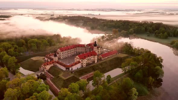 Amazing Dawn in the Foggy Nesvizh, Fog Over the River. Nesvizh. Ancient Castle . Belarus