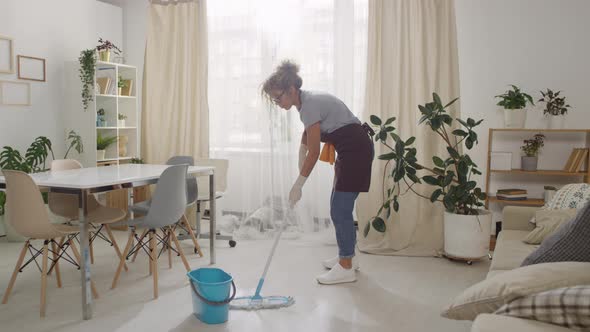 Woman Washing Floor with Mop