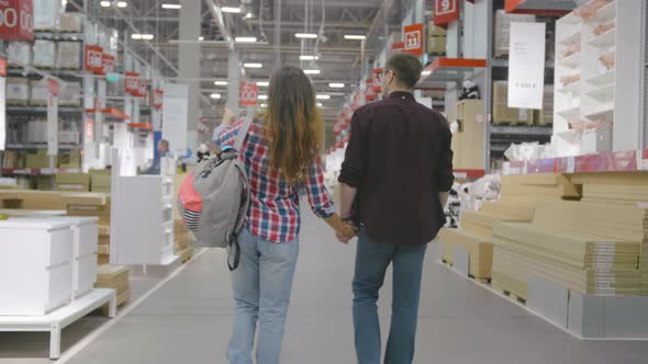 Young Couple Shopping in Modern Household Store