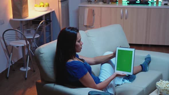Woman Using Touchpad with Green Screen