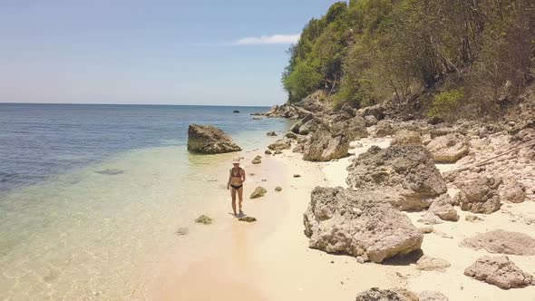 Happy Young Woman Running on Sea at Sandy Beach on Tropical Island at Sunny Day. Aerial View