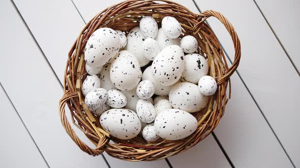 Basket of White Dotted Easter Eggs in Brown Wicker Basket