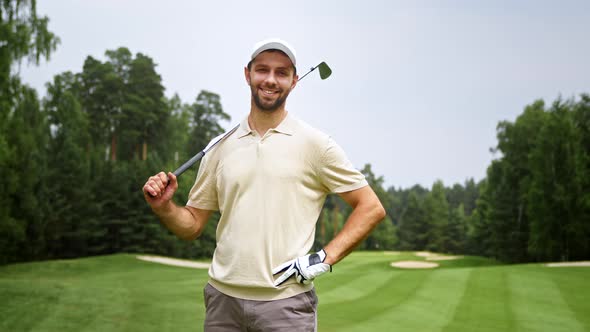 Portrait of a young golfer in uniform on the field