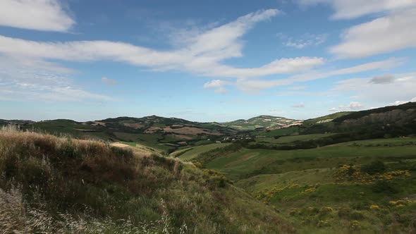 Windy landscape in the hills, pan