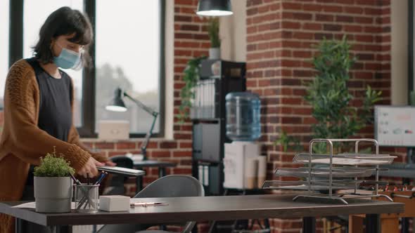 Business Woman Putting Laptop at Desk and Working on Project