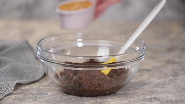 Preparing Chocolate Choux Dough in Bowl, Adding Eggs To the Dough