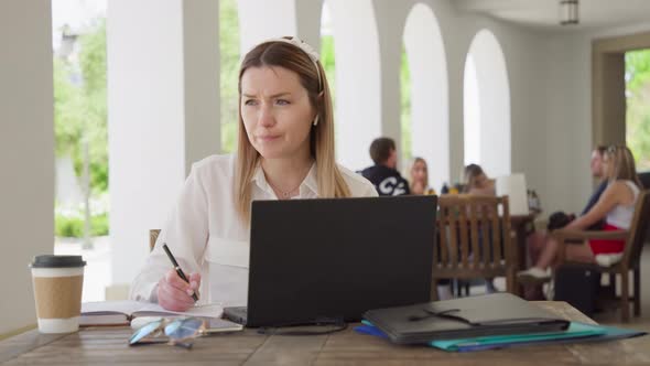 Thoughtful Creative Woman Discussing Future Business Plan By Video Call RED 8K