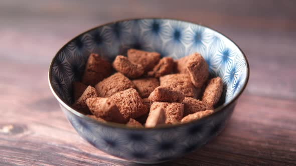 Sweet Fills Chocolate in a Bowl on Table