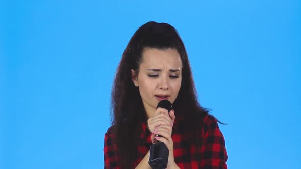 Lady Is Singing in Microphone. Slow Motion