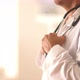 Close up of Hispanic doctor's hands holding stethoscope - VideoHive Item for Sale