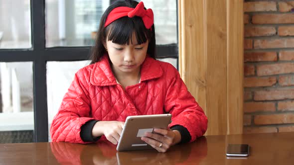 Asian Girl Using Tablet