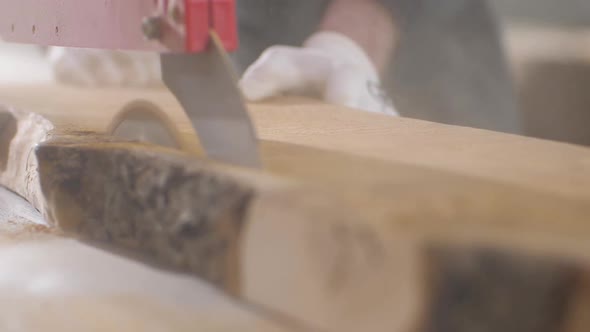 The Process of Cutting Wood Into Boards on an Electric Circular Saw