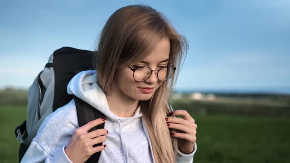 Smiling Face Travel Girl Walking at Natural Park with Backpack