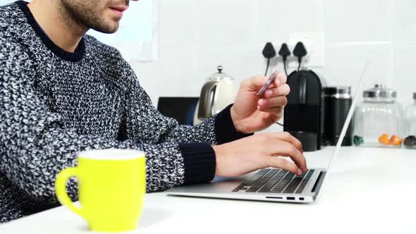 Man shopping online from home