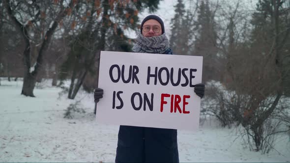 Our House Is On Fire Message On A Protesters Sign Against Planet Global Warming