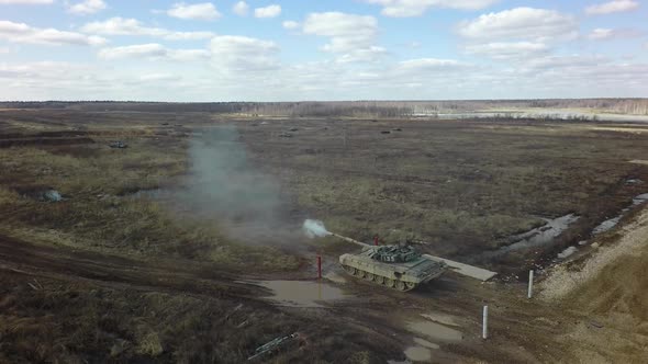 A tank shoots at a shooting range