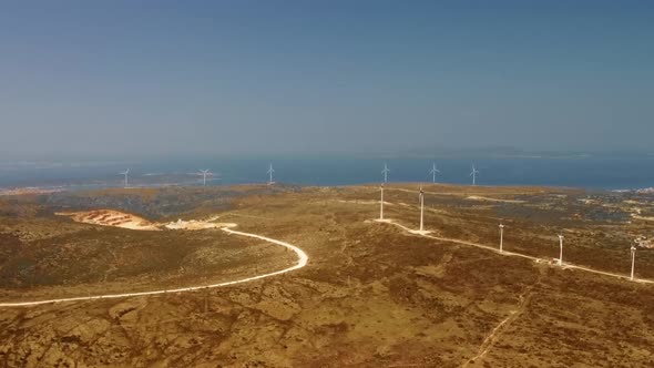 Aerial View Over the Farm Landscape and Wind Turbines Generating Clean Renewable Energy