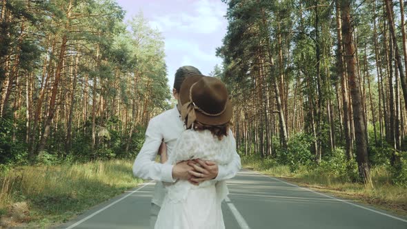 Hipster Couple in Love Walk in Beautiful Place Hold Hands Man and Woman Hugging and Enjoying