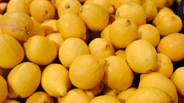Lots of Lemons in the Fruit Market Organic Food for Vegetarians