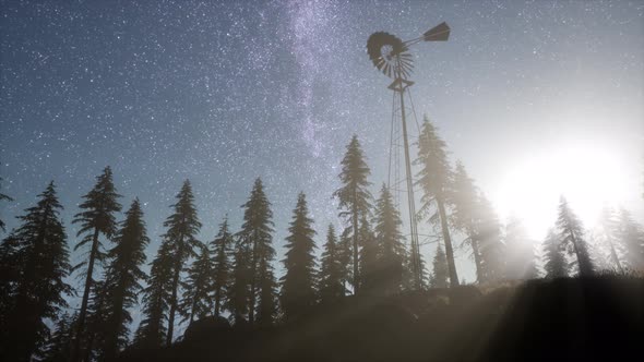 Retro Windmill in Mountain Forest