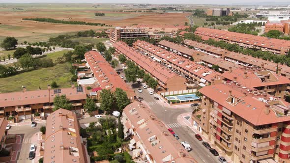 Modern Spanish living district on hot sunny day, aerial view