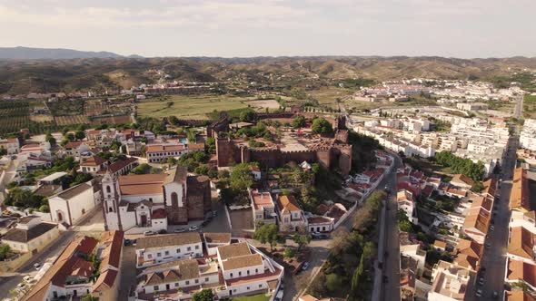 Aerial wide view of Silves townscape and Moorish Castle, Algarve Portugal
