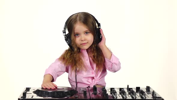 Little Girl in Headphones Plays for Dj Console, Slow Motion