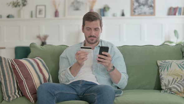 Young Man Unsuccessful Online Payment on Smartphone