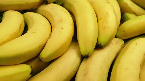 Passing Ripe Yellow Bananas