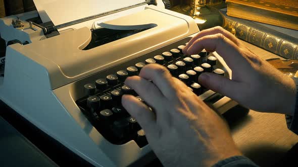 Zoom Out Man Typing In Room With Books