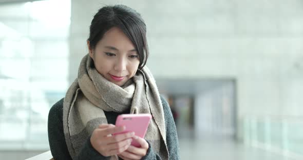 Young woman use of mobile phone in campus