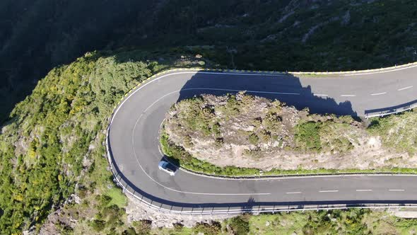Aerial view of a car driving on a serpentine mountain road, Madeira, Portugal