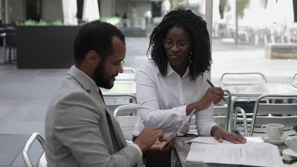 Cheerful Smiling Business People Talking at Outdoor Cafe