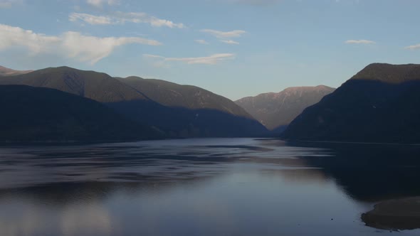 Sunset landscape with lake Teletskoye and mountains in Altai