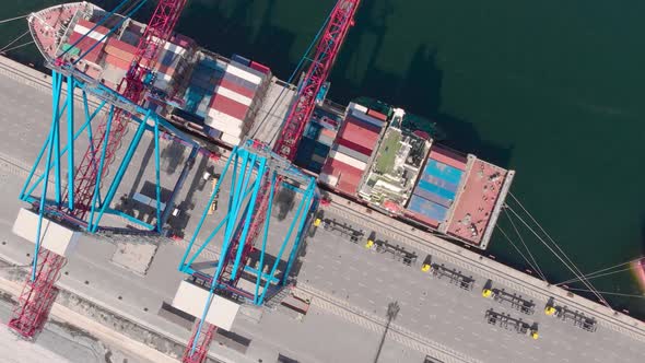 Drone Flying Over a Container Ship During Cargo Operations Over the Customs Area