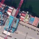 Drone Flying Over a Container Ship During Cargo Operations Over the Customs Area - VideoHive Item for Sale
